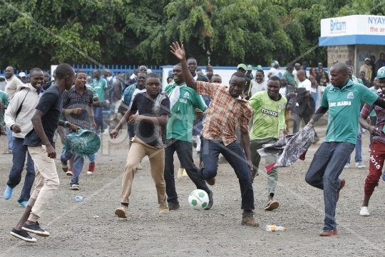 Fansinmockfootballplayoutsidestadium